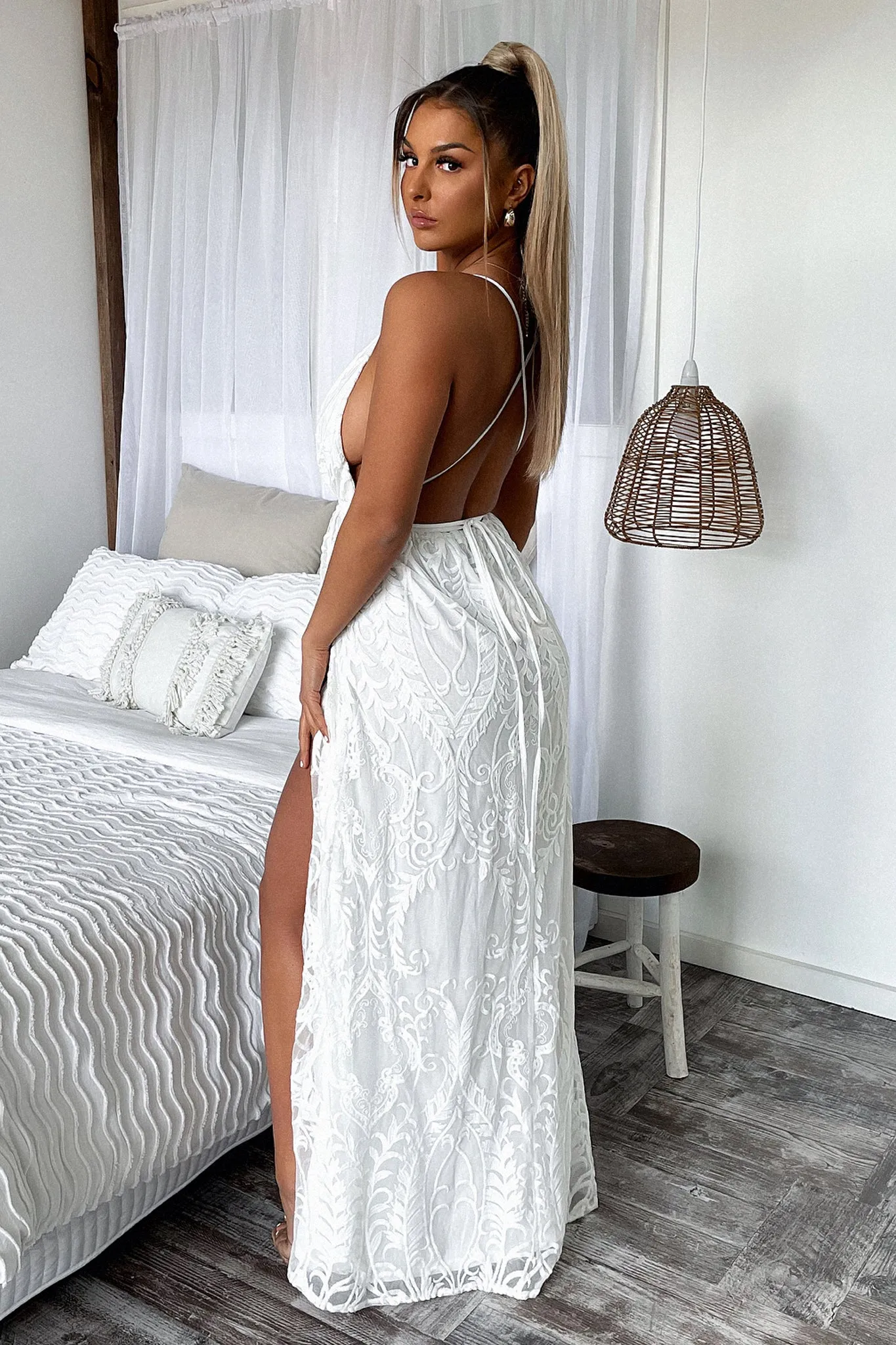 The flowing design of this dress provides plenty of movement while keeping you looking polished Blush Tone Scarlett Halter Maxi Dress - White